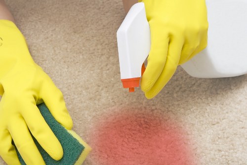 Carpet cleaning team following safe working practices with equipment