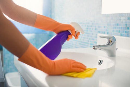 Deep cleaning kitchen and bathroom areas in a Stockwell property