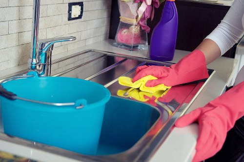 Local cleaning team working in a Stockwell flat with attention to hard-to-reach areas